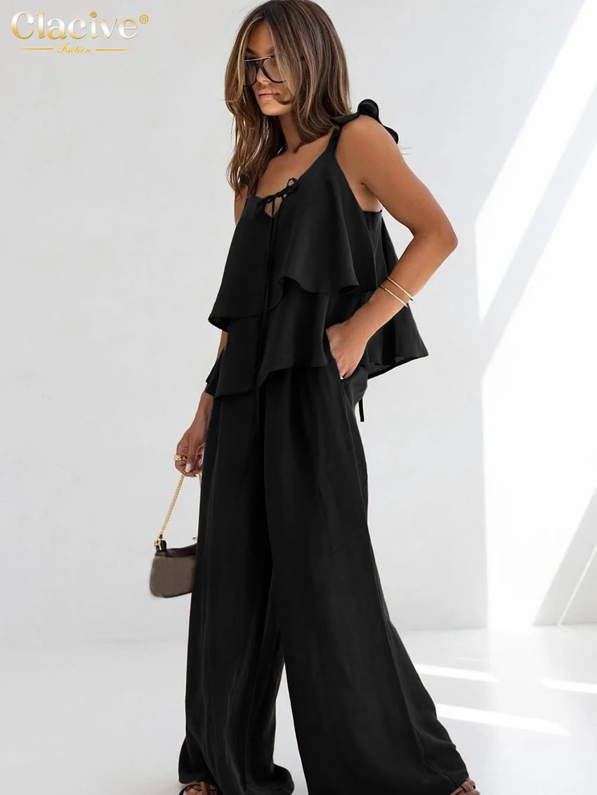 طقم نسائي من قطعتين من القطن الأبيض الفضفاض من Clacive صيفي 2025، مكون من بلوزة بدون أكمام مع بنطلون واسع وخصر مرتفع للنساء 